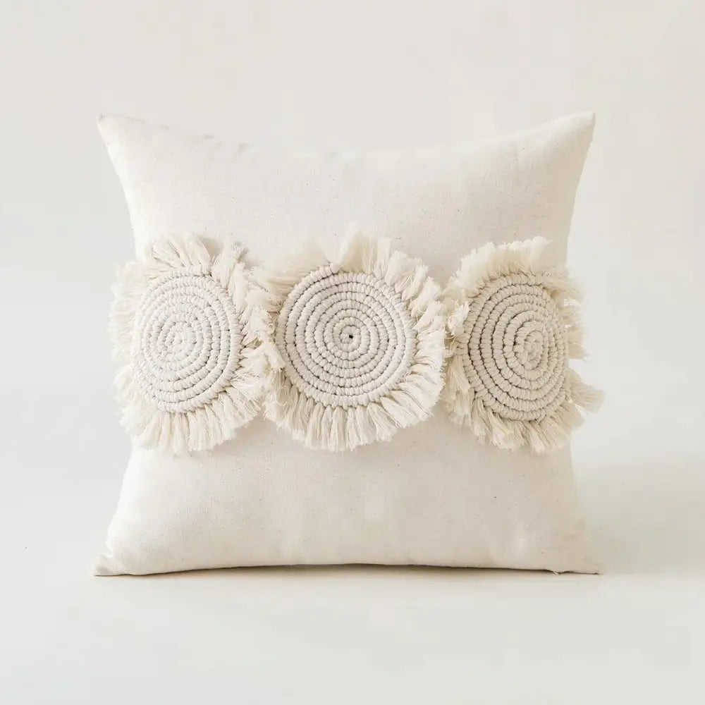 Cream-colored pillow cover with three handcrafted macrame ivory pompom tassel appliqués for living room decorbites decor