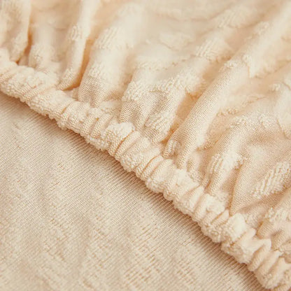 Cream jacquard l sofa seat cover with cream textured fabric and ribbed elasticated waistband for living room sofa cover