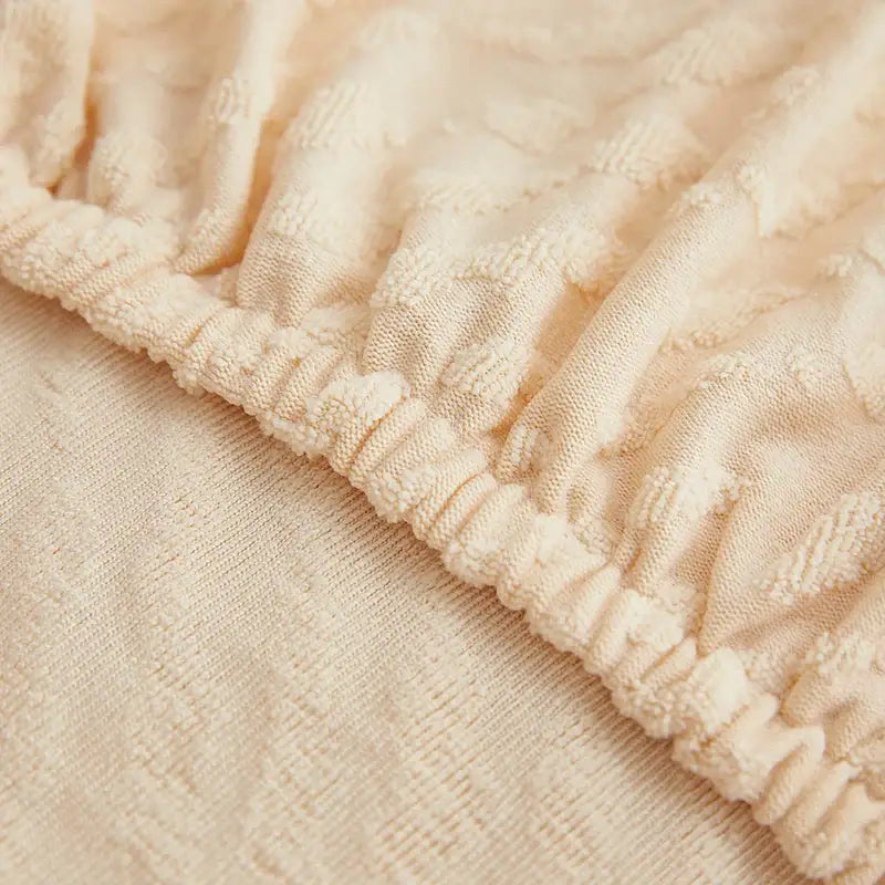 Cream jacquard l sofa seat cover with cream textured fabric and ribbed elasticated waistband for living room sofa cover