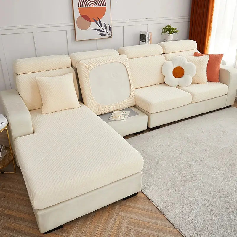 Cream jacquard l sofa seat cover in cream-colored stretch fabric with subtle ribbed texture snugly fitted over sectional