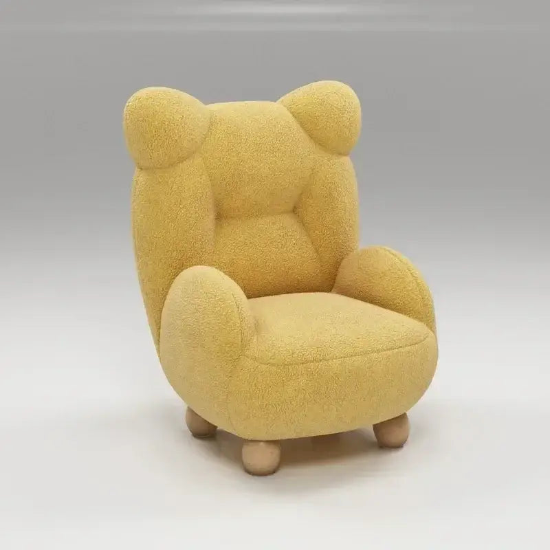 A mustard yellow kids lamb velvet sofa chair with rounded bear ears and wooden legs for decorbites kids lamb seating