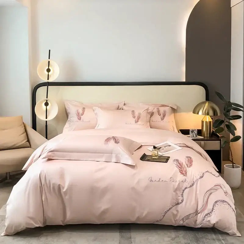 Pink feather-themed satin bedding set with a soft sheen and cotton embroidery bed linens for elegant bedroom decorbites decor