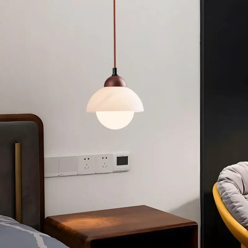 A cream marble led pendant light with a warm copper wood top and glass shade for bedroom decorbites cream marble