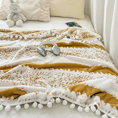 Cream and mustard yellow decorbites jacquard fluffy living room blanket with textured stripes and fluffy ball lace edges