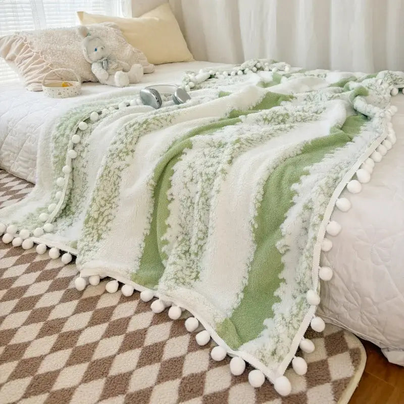 Soft mint-green and white striped plush throw blanket with fluffy ball lace trim from decorbites jacquard fluffy collection