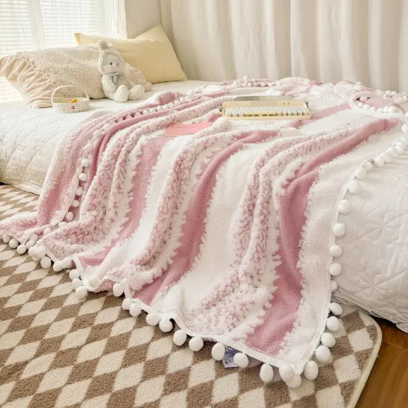 Cream and mustard yellow jacquard fluffy ball lace living room blanket with pink and white striped plush fabric and pom-pom trim