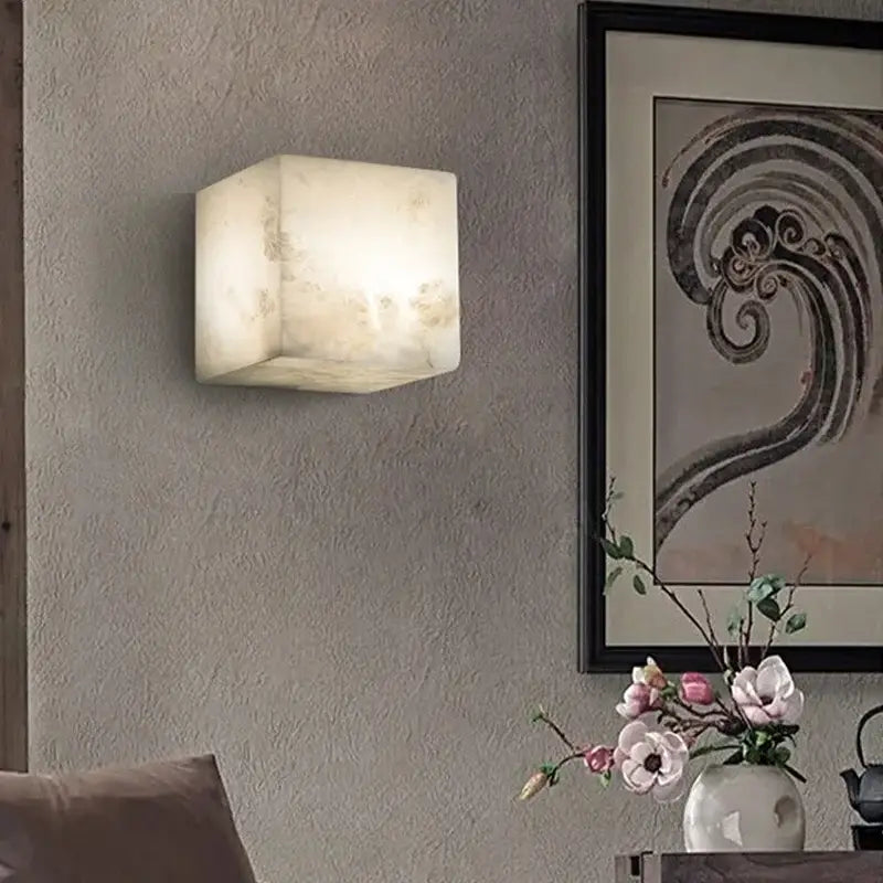 Cream onyx marble cube led wall sconce with smooth translucent stone finish for bedroom lighting and ambiance