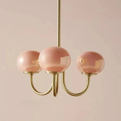 Delicate decorbites cream pink pendant light with three rose-tinted glass globes and polished brass frame for bedroom decor
