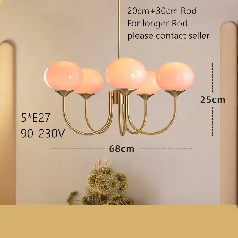 Gold-toned pendant light with five soft pink glass globes for cream pink bedroom decorbites cream pink collection