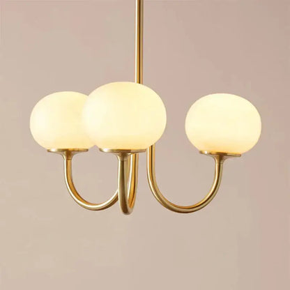 Gold-toned pendant light with three frosted glass globes for cream pink bedroom decorbites cream pink lighting