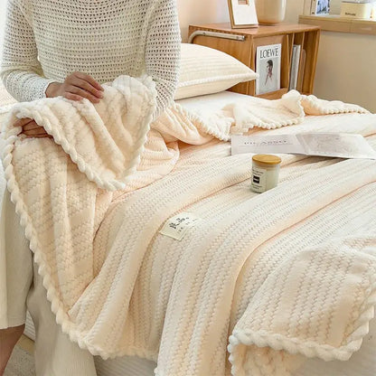 Cream plush double sided jacquard milk velvet blanket with textured knit pattern and braided edge for bedroom throw