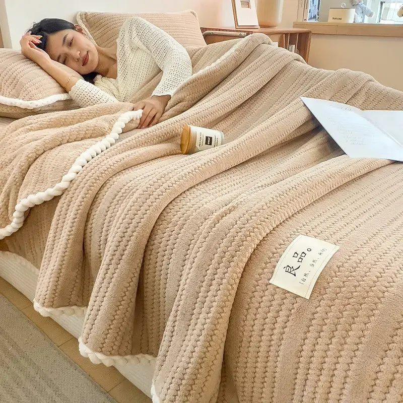 Cream plush double sided jacquard milk velvet blanket with beige textured knit and white pom-pom trim for bedroom throw