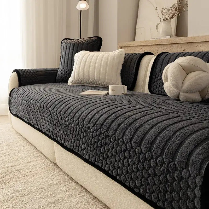 Dark gray textured sofa slipcover with quilted pattern and black trim in jacquard knit for living room use