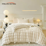 Cream plush rabbit fur bedding set featuring a cream-colored, soft, fluffy bedding set with matching pillowcases