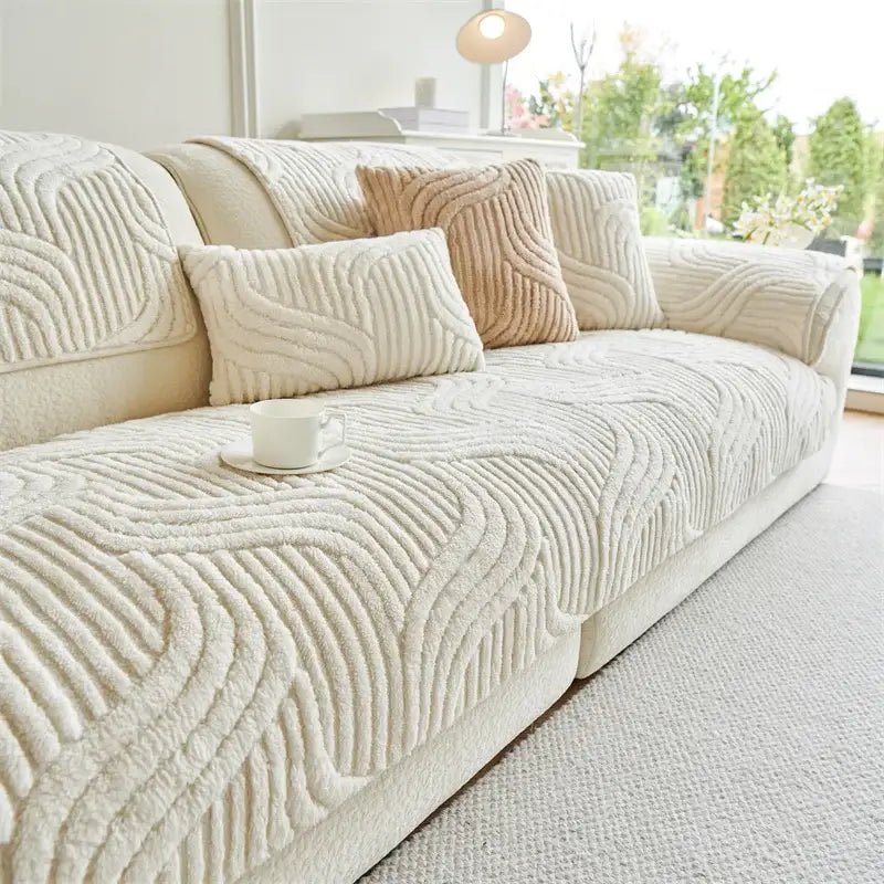 Cream-colored plush sofa cover with textured quilted wave pattern for living room cushion protection and decor