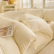 Cream ribbed bubble yarn cotton duvet cover set with matching pillows neatly arranged on a bed for bedroom bedding
