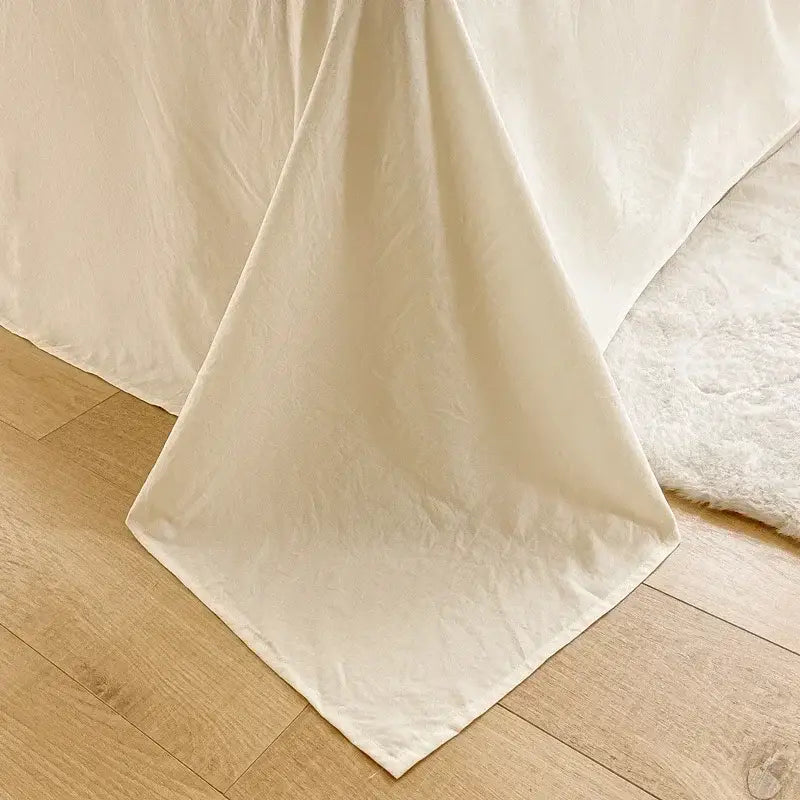 Cream ribbed bubble yarn duvet cover set featuring a cream-colored softly draped linen duvet cover with natural folds