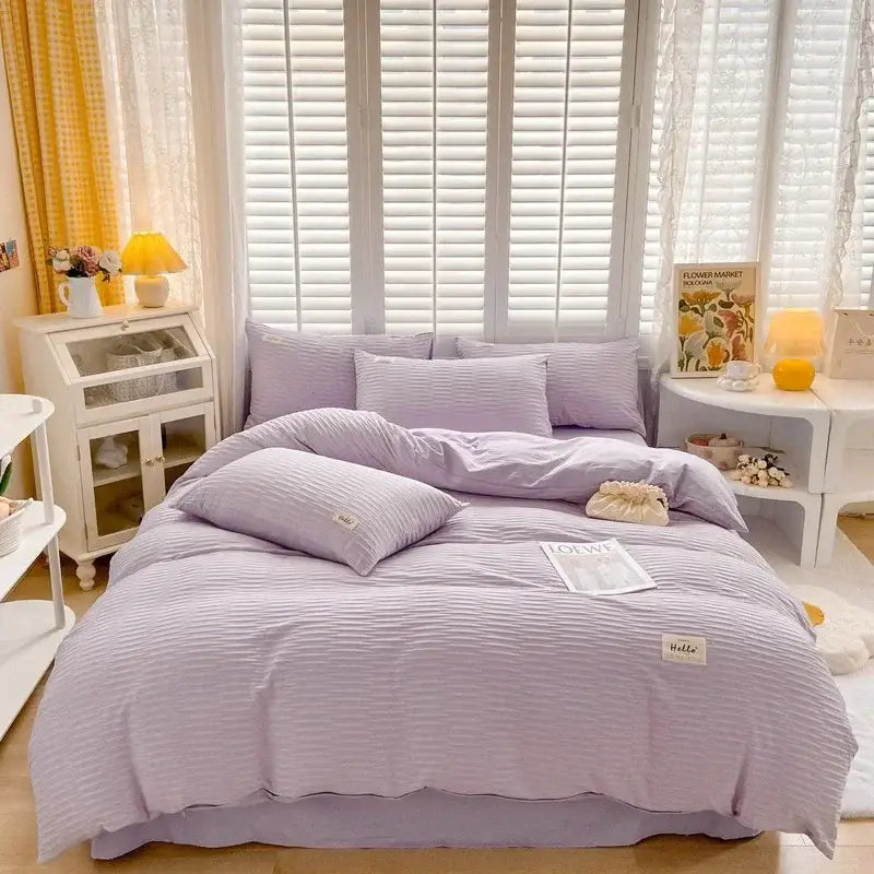 Cream ribbed bubble yarn duvet cover set featuring lavender-striped cotton with soft texture and subtle vertical ridges