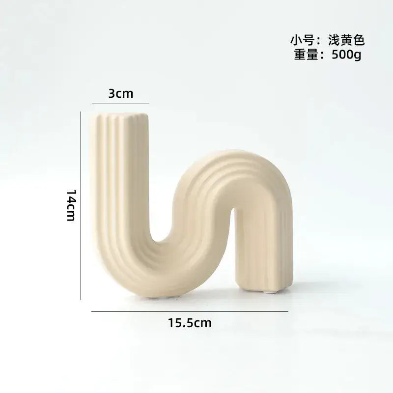 Cream ribbed geometric ceramic vase in s shape with vertical ridges from decorbites geometric for living room decor
