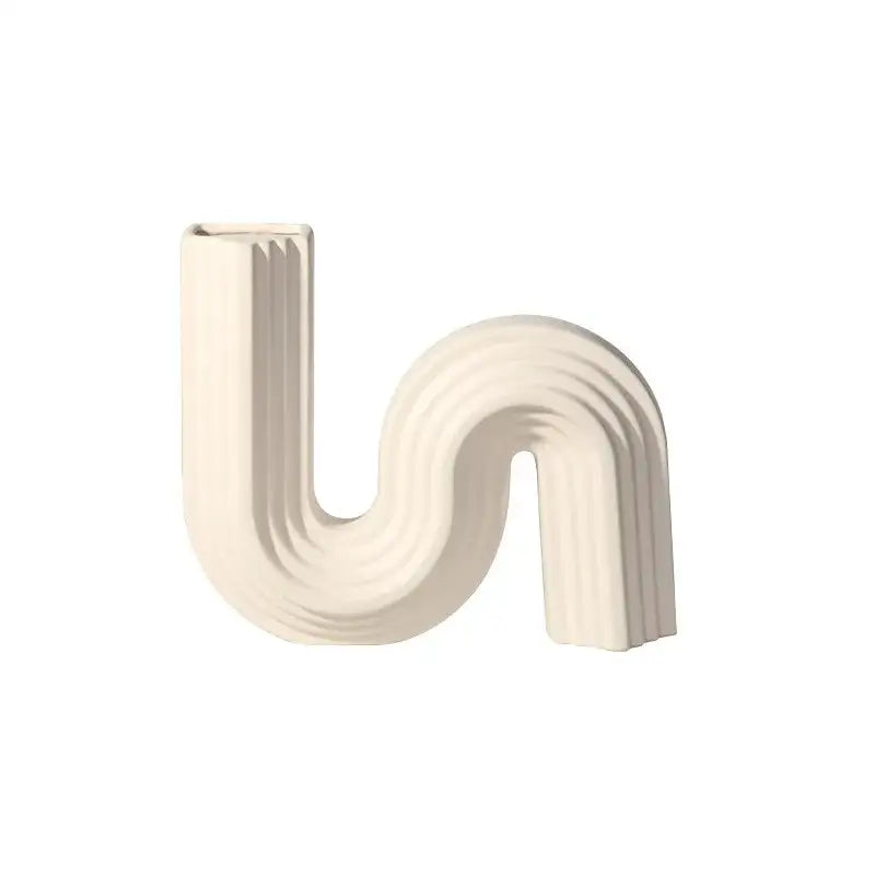 Cream ribbed geometric ceramic vase in cream with s shape design for living room decorbites geometric decor