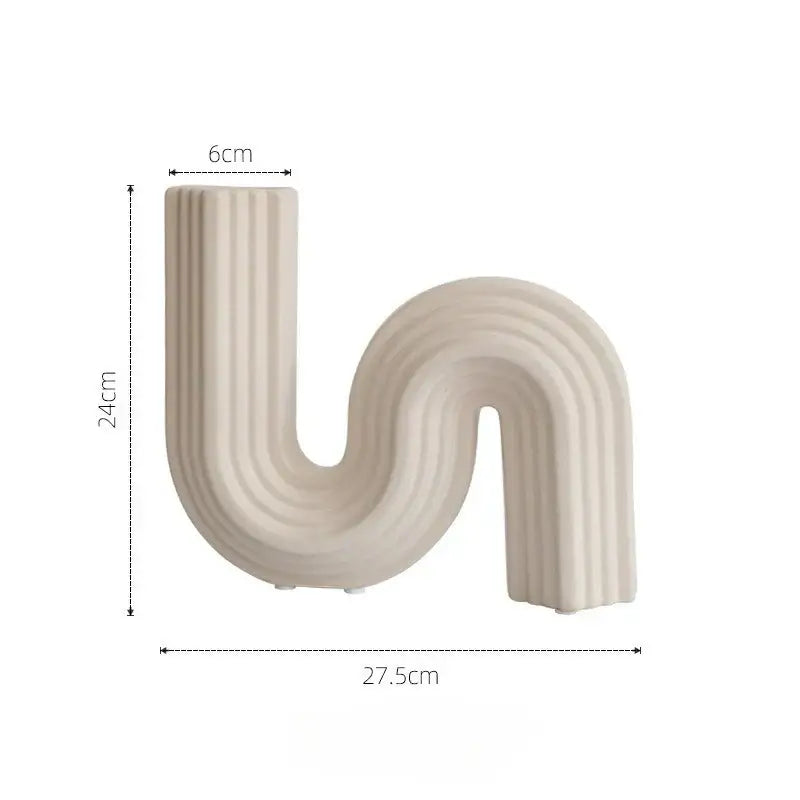 Cream ribbed geometric ceramic vase with s shape curve and vertical ridges for living room decorbites geometric decor
