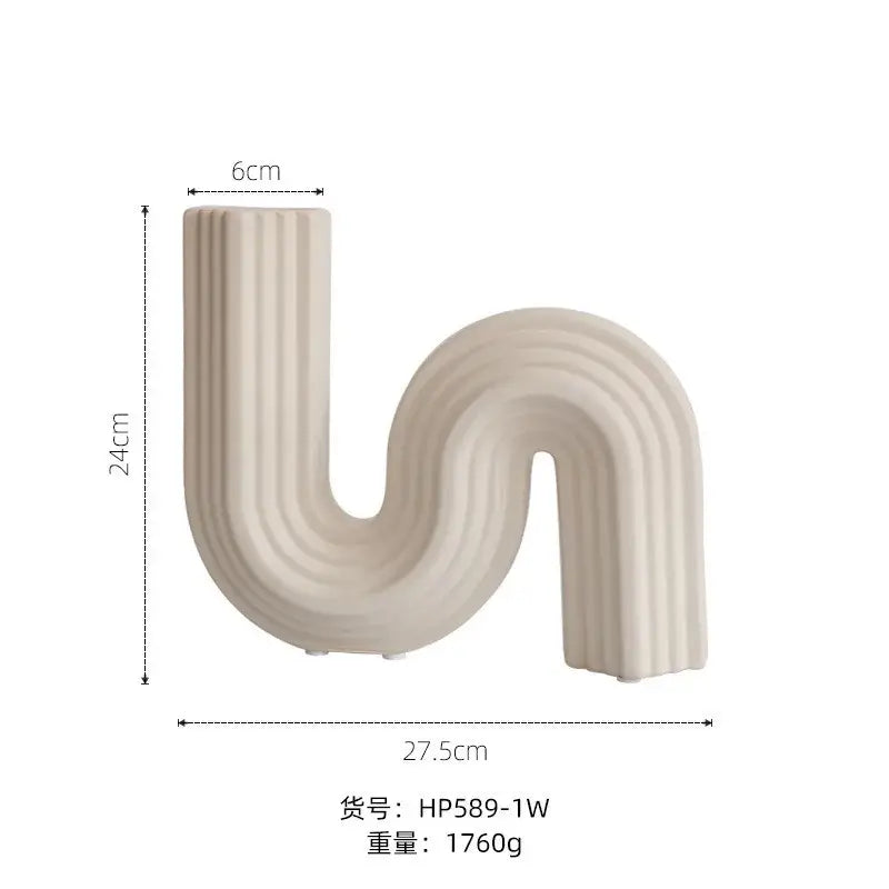 Cream ribbed geometric ceramic vase with sleek s-shaped curve in cream color for stylish living room decor by decorbites geometric