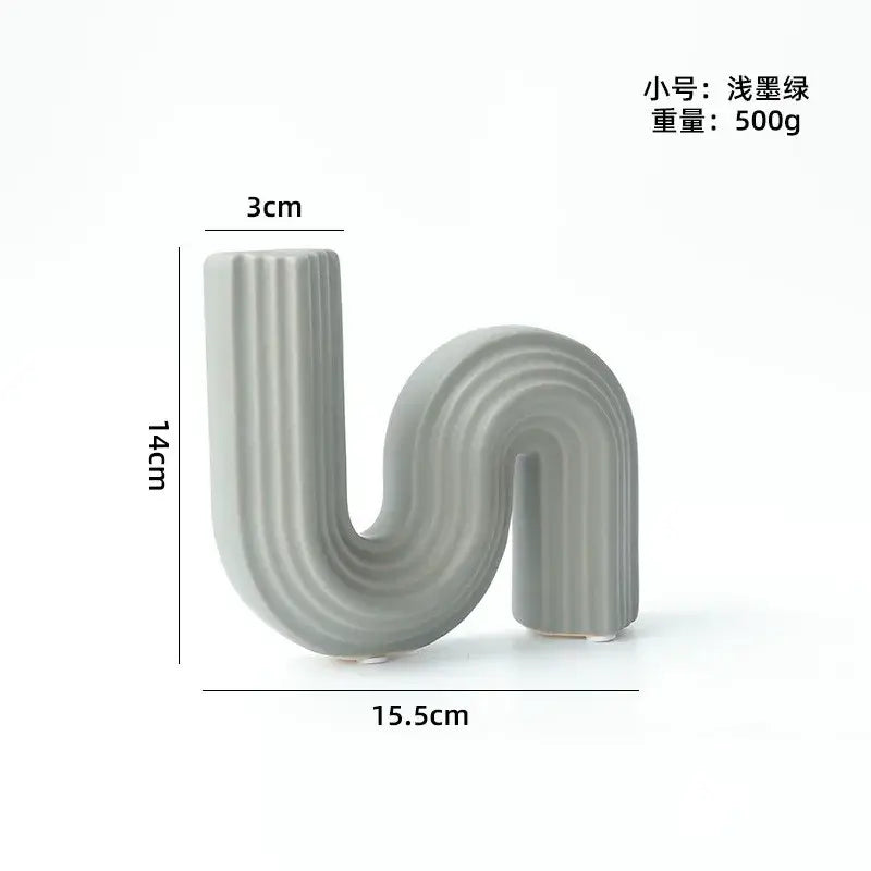 A sleek matte gray s-shaped decorbites geometric ceramic vase with vertical ridges for modern living room decor