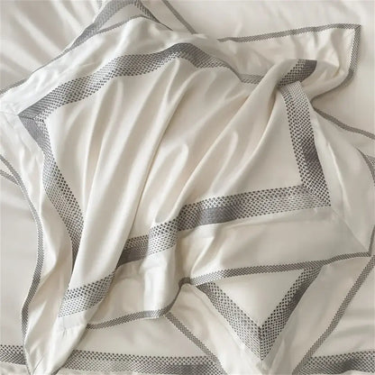Cream satin 1000tc egyptian cotton bedding set with white duvet cover and geometric gray patterned borders silver piping