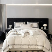 Cream satin 1000tc egyptian cotton bedding set with silver piping and embroidered logo on pillowcases by decorbites