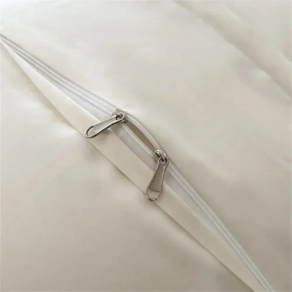 Cream satin 1000tc egyptian cotton bedding set with white satin zipper and silver-toned metal sliders on smooth fabric