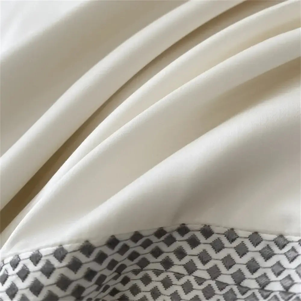 Cream satin 1000tc Egyptian cotton bedding set with gray and white geometric pattern and silver piping decorbites 1000tc Egyptian