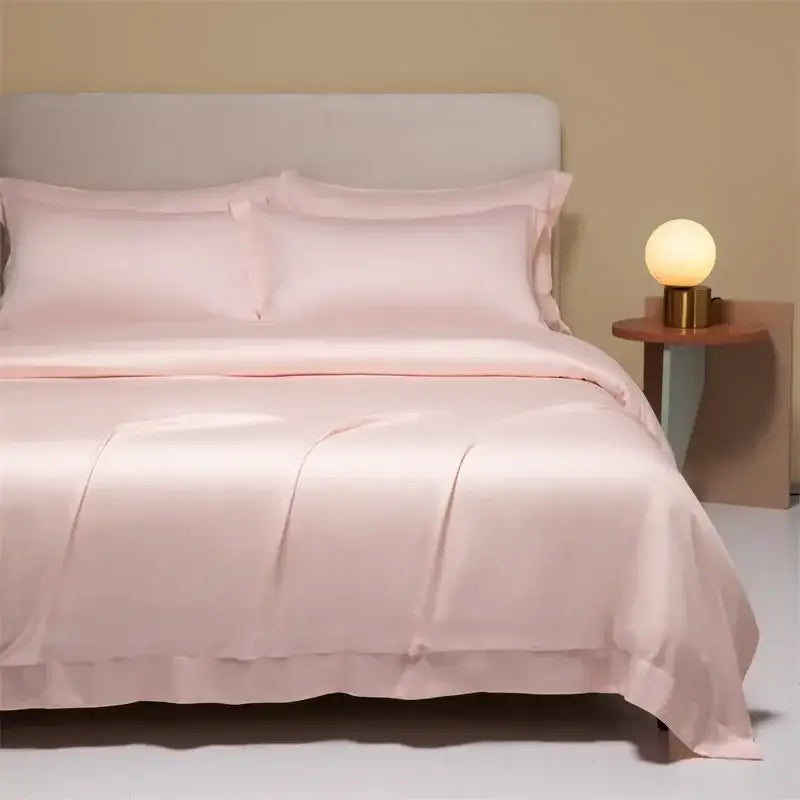 Soft blush pink satin bedding set with ruffled edge made from decorbites 120s natural fabric for cooling comfort
