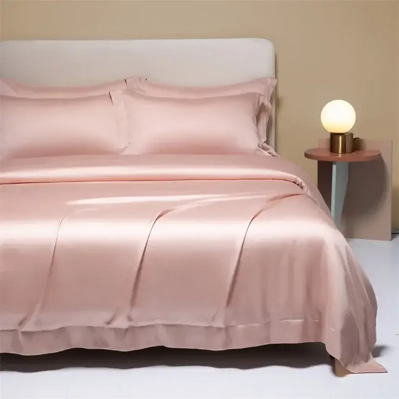 A soft blush pink satin duvet cover bedding set with glossy finish and ruffled edges from decorbites 120s natural fabric