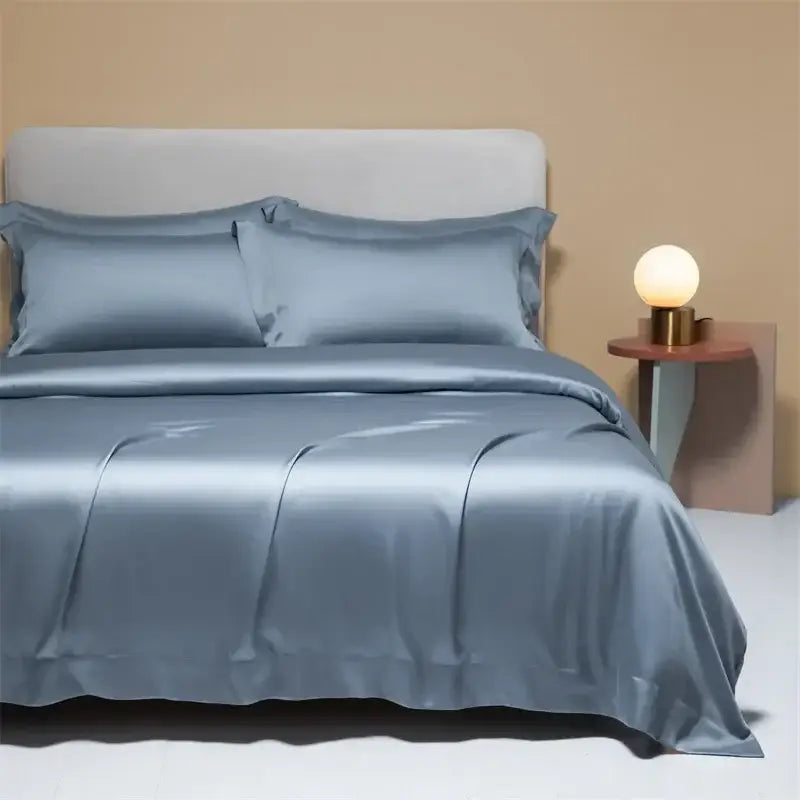Silk satin duvet cover set in muted blue with elegant folds and sheen from decorbites 120s natural fabric bedding set