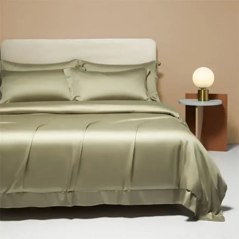 Cream satin 120s natural fabric bedding set in satin green with matching pillows and a smooth glossy finish