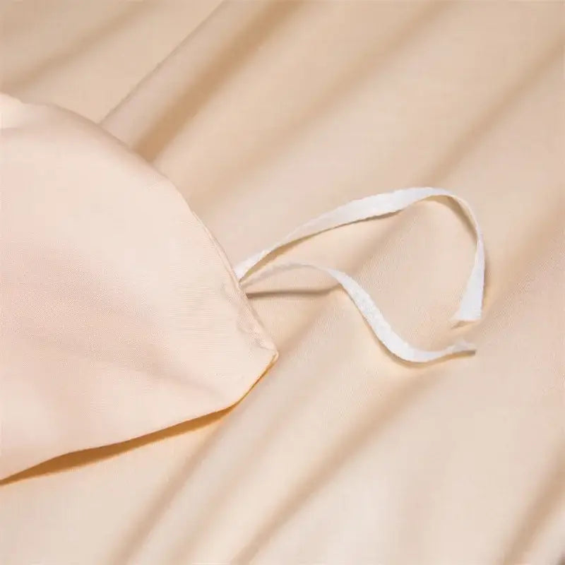 Beige satin pillowcase with white drawstring from decorbites 120s natural fabric bedding set for cooling comfort