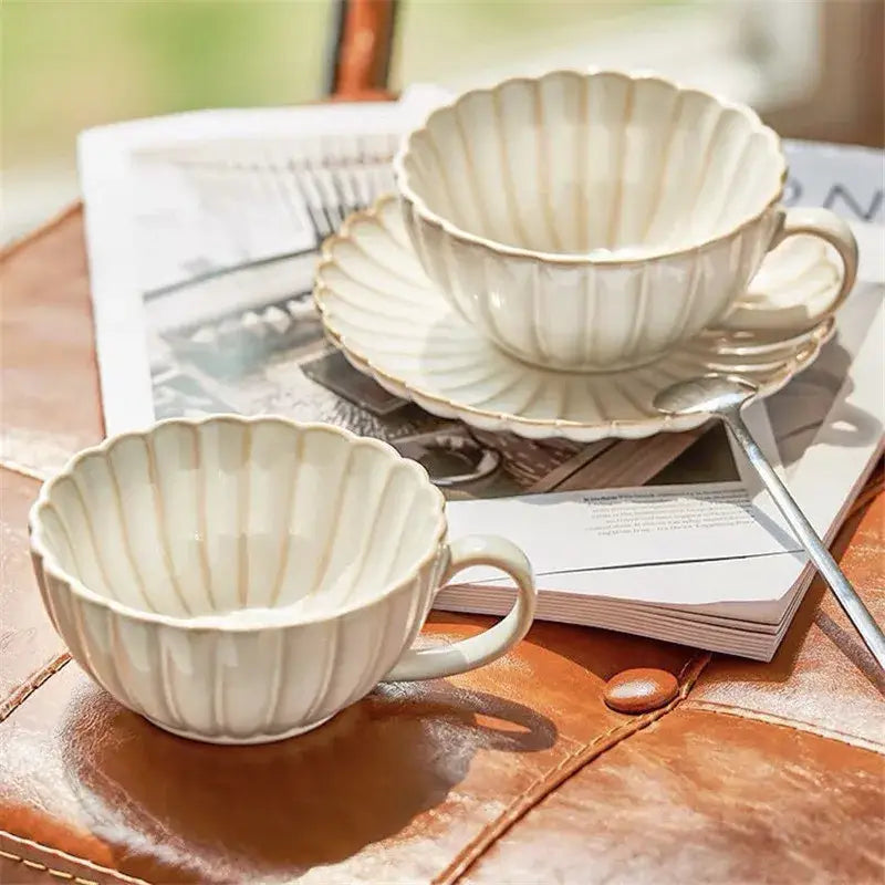Cream scalloped ceramic afternoon tea cup and saucer set in cream color for elegant ceramic afternoon tea decorbites use