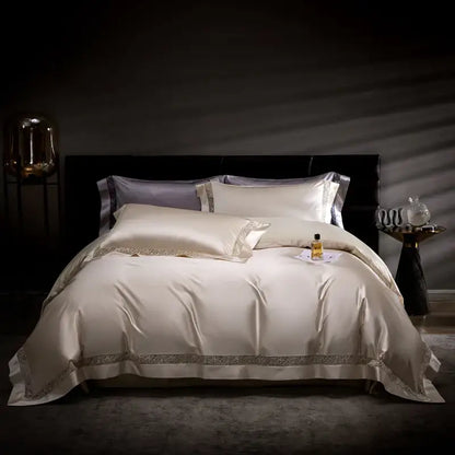 Cream-colored satin bedding set with silver embroidery edges from decorbites damask lyocell cotton collection