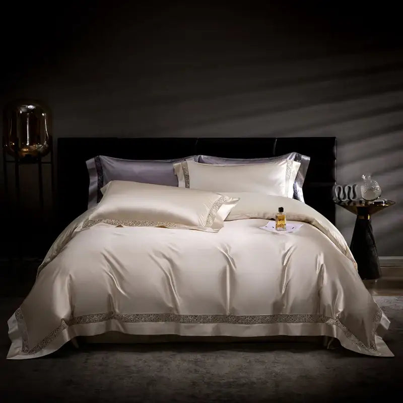 Cream-colored satin bedding set with silver embroidery edges from decorbites damask lyocell cotton collection