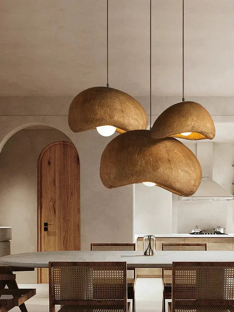 Three hanging cream style cloud pendant lamps with textured earthy brown dome shades for dining room decorbites cream style