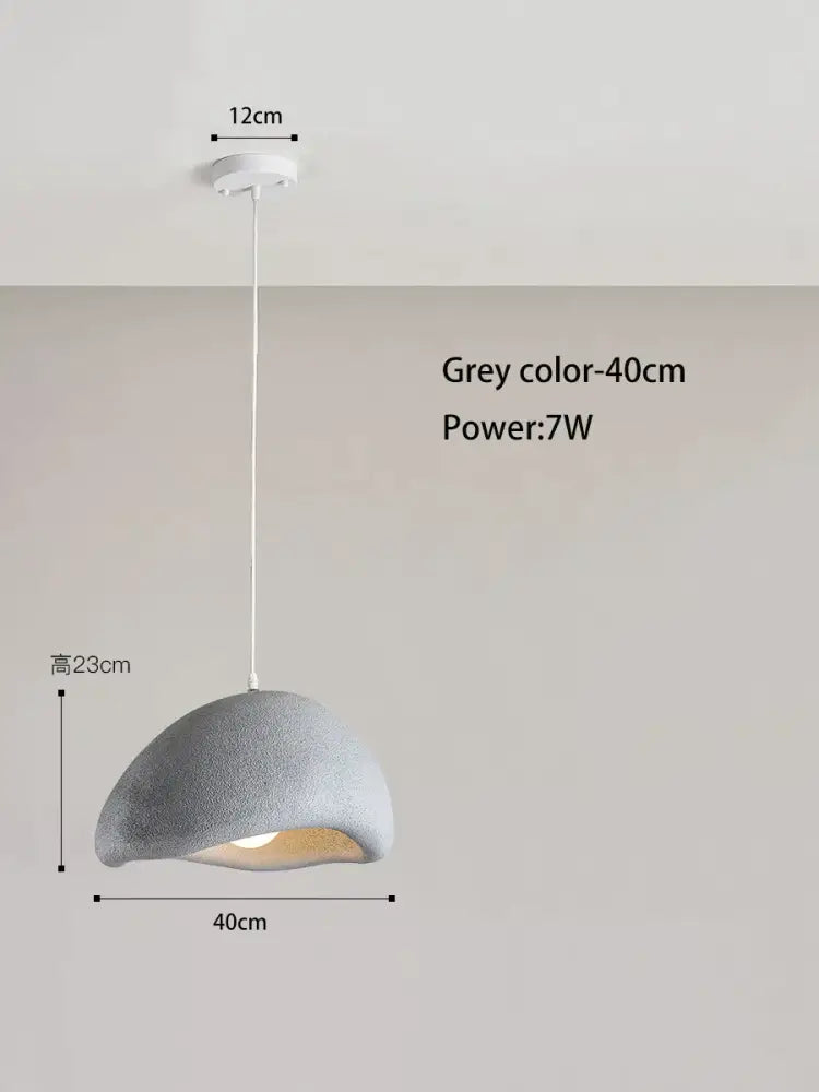 A modern grey pendant lamp with a textured dome shade and white cord from decorbites cream style cloud collection
