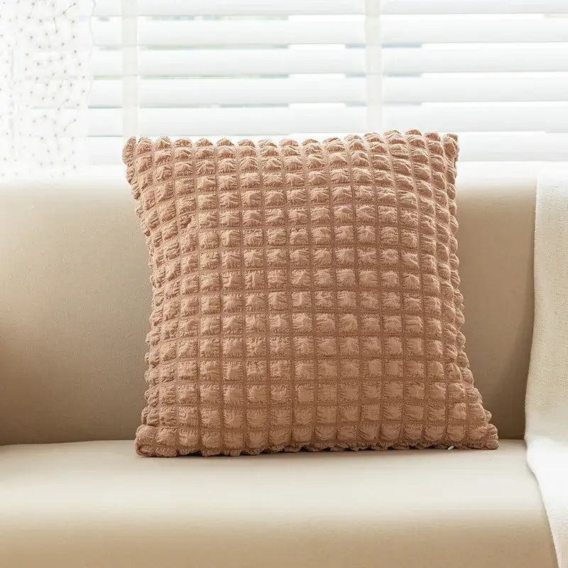 Beige textured cushion cover with raised grid pattern featuring elastic puff plaid design for living room decor