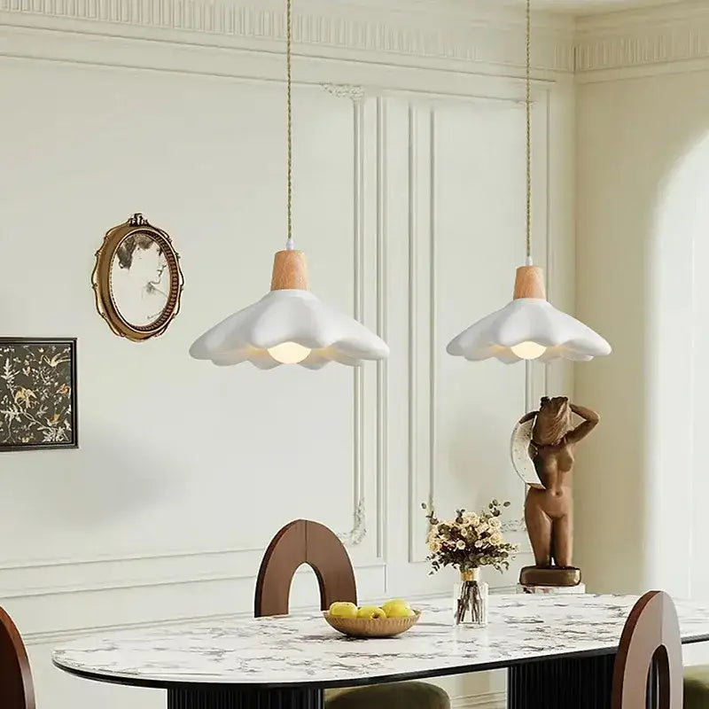 Two white ceramic pendant lights with wooden tops hang from ceiling decorbites cream style led flower chandelier