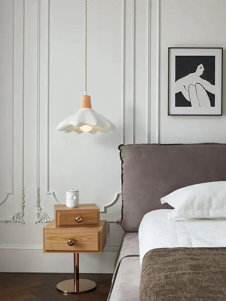 Cream style led flower chandelier with white flower-shaped pendant, wooden top, and gold-toned hanging cord for bedroom decorbites cream style
