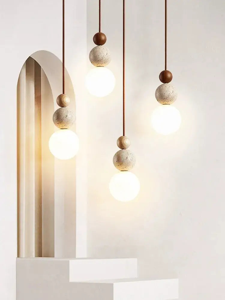 Modern cream style led pendant lamp with warm glowing bulbs and textured concrete spheres for bedroom decorbites cream style