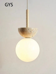 A cream style nordic pendant lamp with a textured beige stone top and frosted glass globe for bedroom decorbites decor