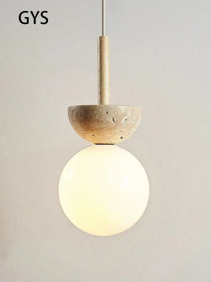A cream style nordic pendant lamp with a textured beige stone top and frosted glass globe for bedroom decorbites decor