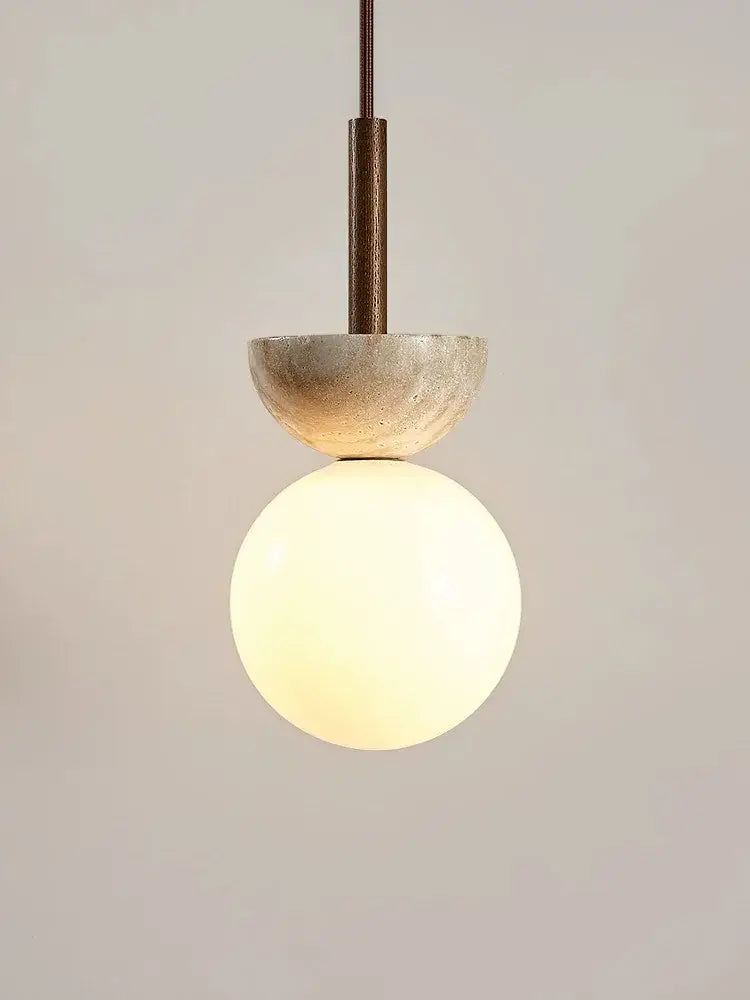 Cream style nordic pendant lamp with matte bronze stem, textured beige stone, and opal glass globe for bedroom decorbites cream style