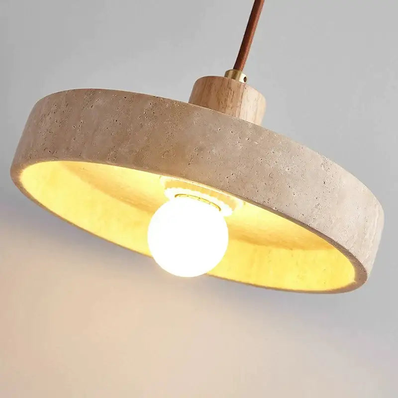 Minimalist pendant light with textured beige concrete ring warm gold interior and walnut wood top decorbites cream style