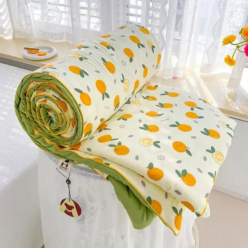 Cream teddy bear breathable double gauze quilt with orange fruit pattern and olive green lining for bedroom bedding